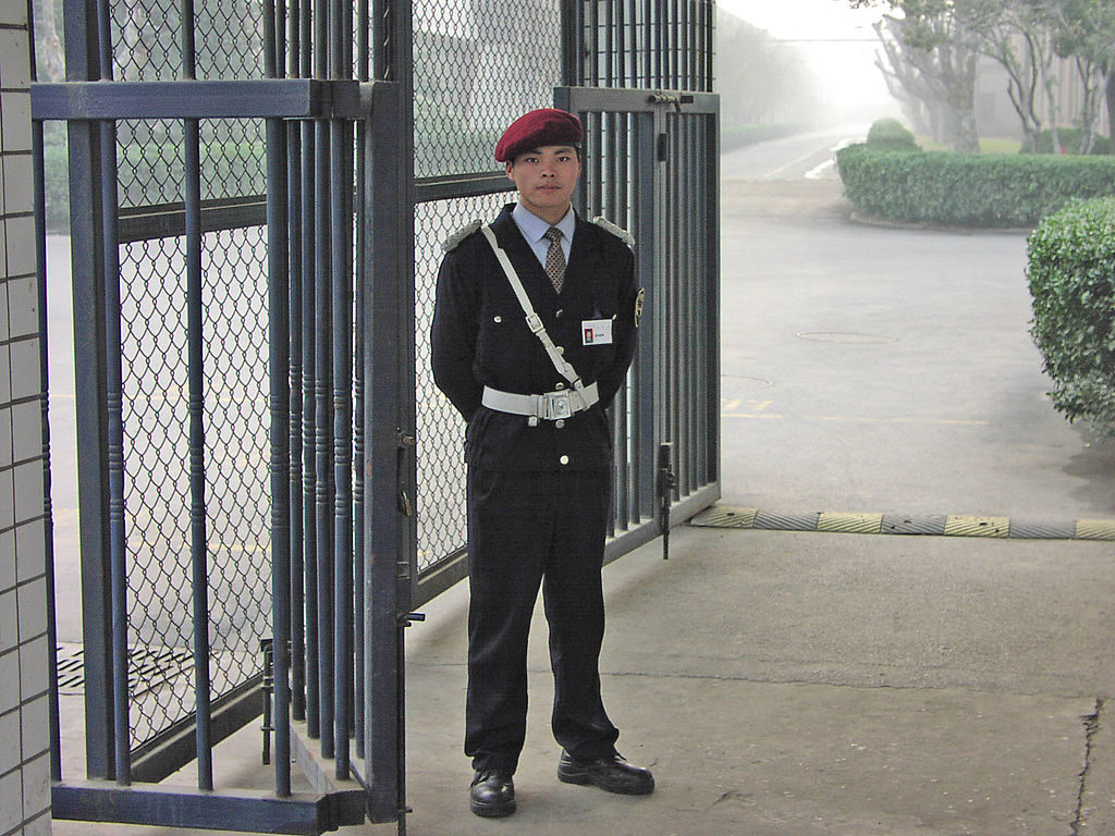 A private security guard at a Chinese factory in February 2004.