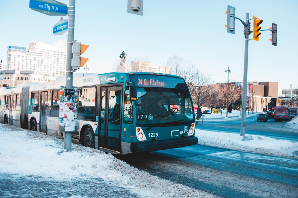 A parked bus on a snow covered street