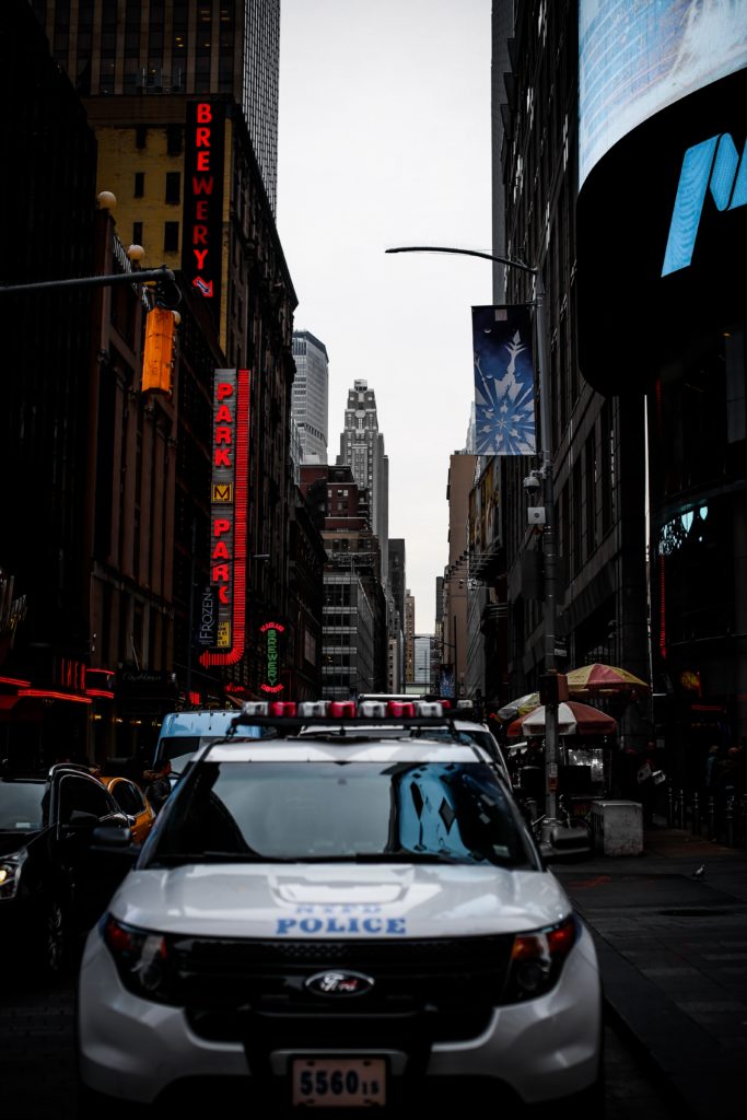A cop car patrolling the city streets